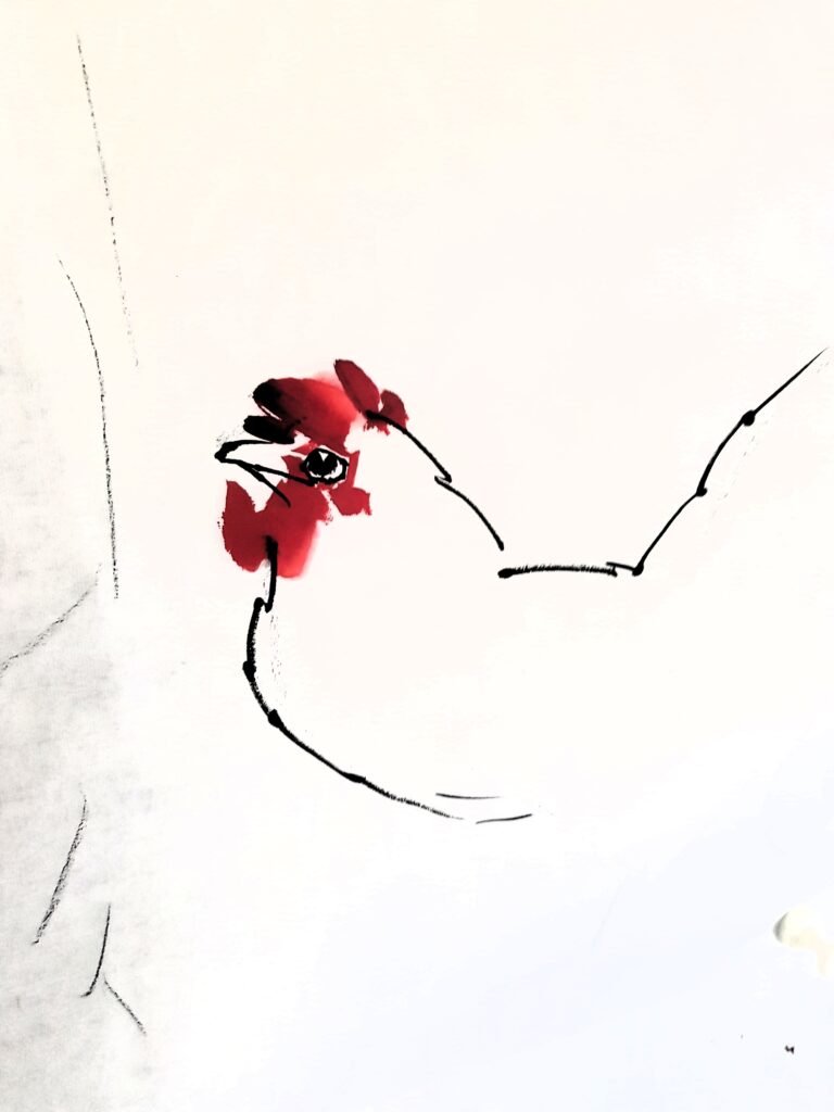 A Chinese brush painting of a hen in progress. The head and body mostly delineated in black Chinese ink; the hen's red comb, eyes and beak are complete