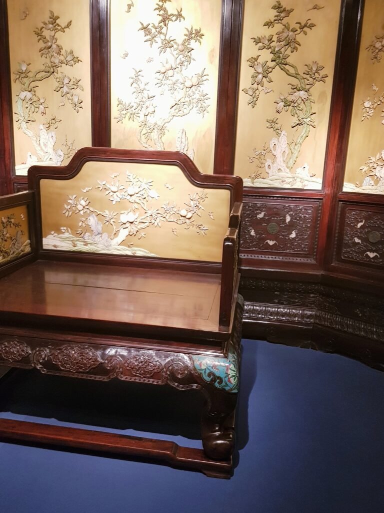 Ornate Qing dynasty throne chair with matching screen, as seen displayed in the Shanghai Museum in May 2019