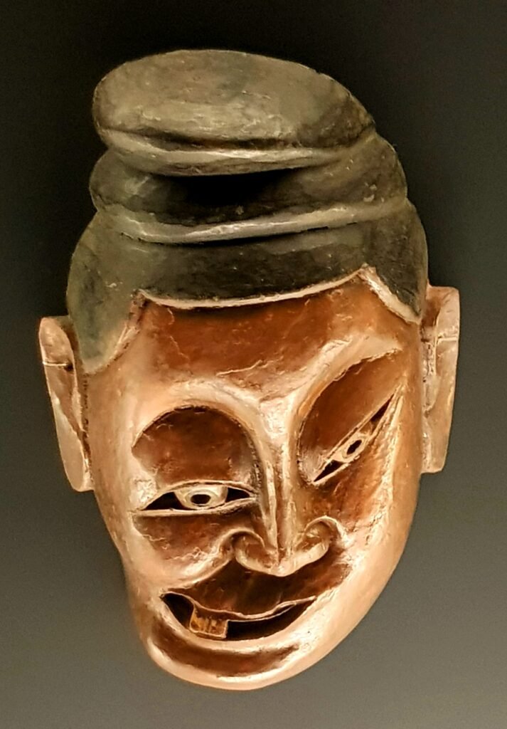 A Nuo opera mask made by the Tujia people in Guizhou, as seen on display in the Shanghai Museum Ethnic Minorities Gallery in May 2019