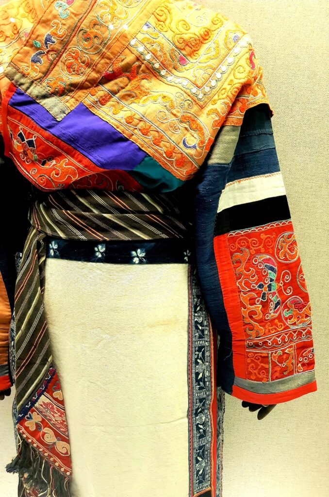 Detail of multi-coloured Miao ceremonial dress in the second half of the 20th century