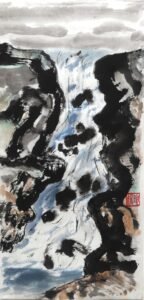 A painting of a waterfall with large boulders to either side painted in black ink with hints of grey and red ochre. The water is painted tumbling over and around jutting black rocks